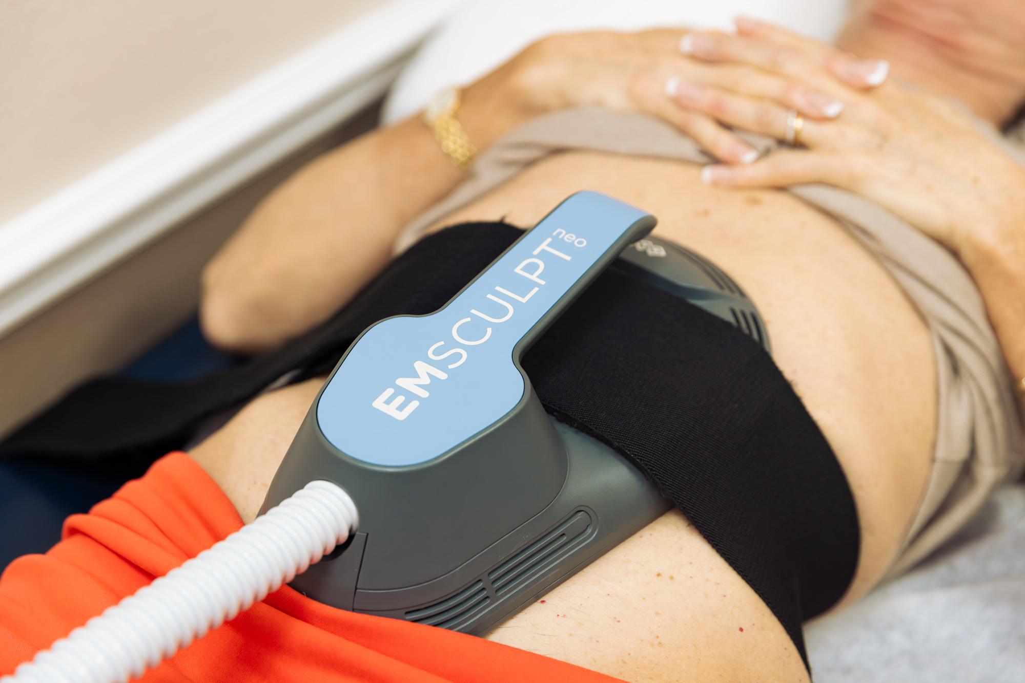 A close-up of a woman's stomach as she receives a treatment for body sculpting in Ocala