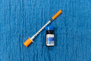 A close up of a syringe and a vial of semaglutide for weight loss in Ocala.